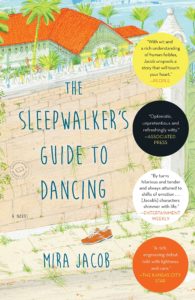 The sleepwalker's guide to dancing: a novel by mira jacob, depicted with colorful illustrations of a dreamy, tropical locale featuring palm trees, vibrant houses, and an elephant, alluding to the rich tapestry of storytelling within.