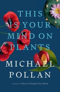 A book cover for "this is your mind on plants" by michael pollan, featuring a collage of vibrant botanical illustrations against a deep blue background.