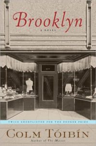 Vintage charm: the cover of 'brooklyn' by colm tóibín, featuring an old-fashioned shopfront, evoking the novel's historical setting and allure.