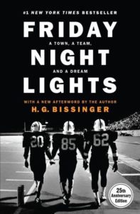 A group of football players walking side by side on the field, captured in a silhouette against the stadium lights, representing camaraderie and the spirit of high school football, on the cover of the 25th anniversary edition of "friday night lights" by h.g. bissinger.