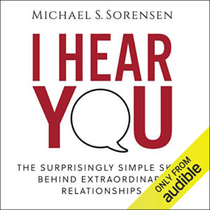 Cover of the audiobook "i hear you: the surprisingly simple skill behind extraordinary relationships" by michael s. sorensen, available on audible, featuring large, bold typography with a speech bubble as the letter 'o' in "you".