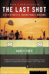 A book cover for "the last shot: city streets, basketball dreams" by darcy frey, featuring an image of a sunset with the silhouette of a person playing basketball, portraying the theme of striving for sports achievement in an urban setting.