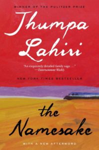 Cover of the book "the namesake" by jhumpa lahiri, featuring a landscape painting and a red background with critical acclaim from entertainment weekly and the new york times bestseller notation.