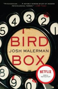 A book cover for "bird box" by josh malerman, advertising it as a notable psychological thriller and mentioning its adaptation into a netflix film, with a design featuring a vintage rotary phone dial.