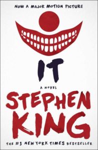 A minimalist book cover design with a sinister red smile and eerie eyes, hinting at the horror within stephen king's novel "it.