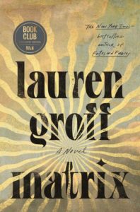 A book cover for "matrix: a novel" by lauren groff, featuring stylized golden sunburst patterns on a black background, with a book club exclusive edition label from barnes & noble.