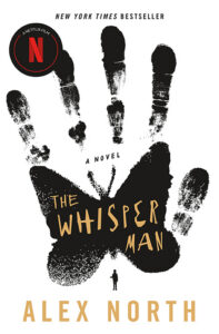 White book cover with a black handprint forming a butterfly. Title: "The Whisper Man" by Alex North.