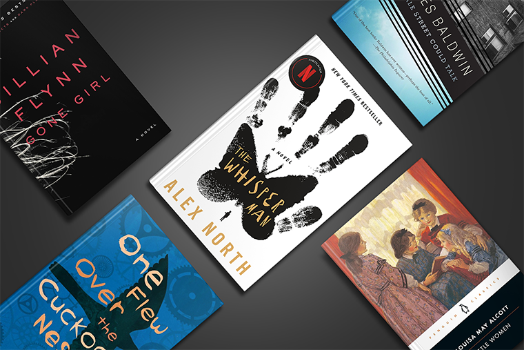 Five books are arranged on a gray surface, with covers visible and tilted at various angles.