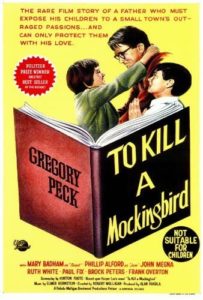 Vintage movie poster for "to kill a mockingbird" starring gregory peck, featuring prominent character illustrations and bold text announcing the film title and critical acclaim.