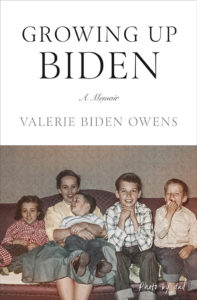 A nostalgic family moment: children smiling and cuddling on a couch, captured in a black-and-white photo, which sets the scene for a personal memoir titled "growing up biden.
