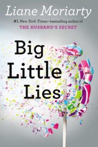 A colorful book cover with confetti and a broken lollipop, titled "big little lies" by liane moriarty, the #1 new york times-bestselling author of "the husband's secret".