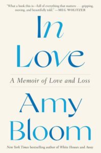 A book cover titled "in love: a memoir of love and loss" by amy bloom, featuring a quote by meg wolitzer and a note mentioning amy bloom as the new york times bestselling author of white houses, set against a simple white backdrop with the title in black and blue font.