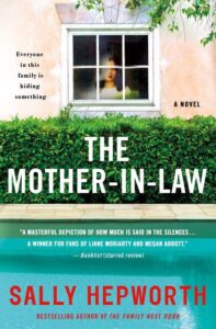 A mysterious and suspenseful novel cover, "the mother-in-law" by sally hepworth, teasing family secrets with a solitary figure peering through a window above an overgrown hedge.
