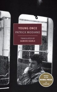 A contemplative young man gazes out of a train window on a rainy day, featured on the cover of patrick modiano's novel "young once," showcasing its status as a nobel prize in literature winner.