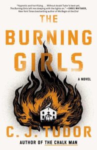 A book cover for the novel "the burning girls" by c. j. tudor featuring a striking illustration of orange flames intertwined with black smoke, evocative of mystery and intensity.