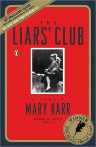 A book cover featuring the title "the liars' club" by mary karr in bold white letters against a red background, with a black-and-white photograph of a young girl in the center, and accolades from "the new york times" and "entertainment weekly" along with an award seal for the pen/martha albrand award for nonfiction.