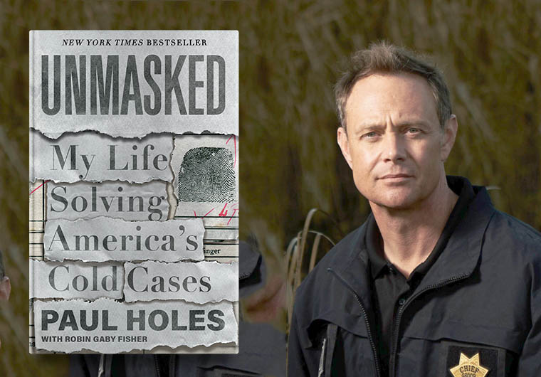 A man in a law enforcement uniform stands beside an image of a book cover titled "unmasked: my life solving america's cold cases" by paul holes with robin fisher, suggesting he may be the author or connected to the content of the book.