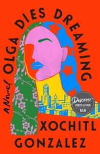 Colorful book cover for "olga dies dreaming" by xochitl gonzalez, featuring a stylized profile of a woman with cityscape and floral elements against a vibrant orange background.