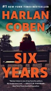 A contemplative person sitting on a bench overlooking a body of water on a serene day, with the text indicating the book title "six years" by harlan coben, a #1 new york times bestseller.
