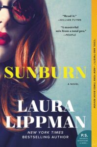 A book cover featuring the title "sunburn" by laura lippman, with a close-up image of a woman wearing sunglasses that reflect a beach scene, hinting at a gripping story full of mystery and intrigue.