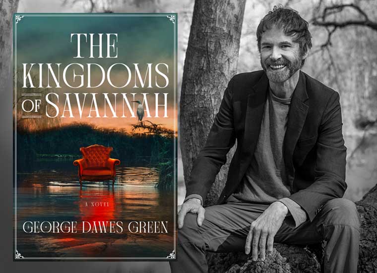 An author smiling proudly beside his newly published novel, "the kingdoms of savannah.