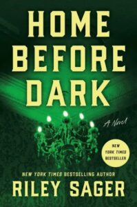 A haunting book cover with a title "home before dark," by riley sager, suggests a thrilling story, with a chandelier set against an eerie green backdrop, hinting at mystery and suspense.