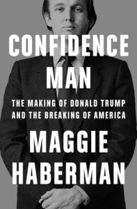 A monochrome book cover featuring a man in a suit, with the title "confidence man: the making of donald trump and the breaking of america" by maggie haberman, overlaying the image.