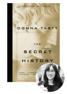 A paperback edition of donna tartt's novel "the secret history" with a monotone photograph of a smiling woman with glasses overlaid in the bottom right corner.