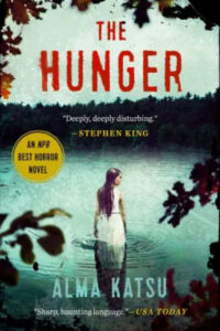 A compelling book cover with dark and suspenseful undertones, featuring a solitary figure standing in a body of water surrounded by a gloomy forest, which alludes to a chilling narrative. the book is touted as "the hunger" by alma katsu, with accolades from stephen king and usa today, suggesting a gripping horror story.