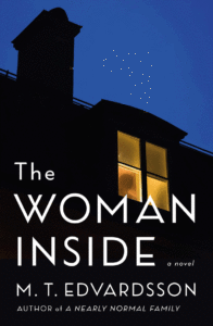 A mysterious silhouette in a warmly lit window against the evening sky on the cover of 'the woman inside,' a novel by m. t. edvardsson.