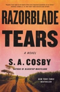 A novel cover for "razorblade tears" by s. a. cosby, featuring a sunset-tinted road stretching into the horizon, flanked by fields and trees, evoking a sense of a journey or pursuit amidst a rural setting.