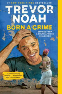A colorful book cover of trevor noah's "born a crime" featuring a painted illustration of a young boy with a backpack walking past a larger, joyful portrait of trevor noah on a wall.
