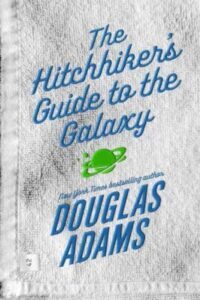 A well-worn book cover of "the hitchhiker's guide to the galaxy" by douglas adams, featuring iconic blue and green text with an illustration of a planet and spaceship, suggesting a beloved science fiction adventure.