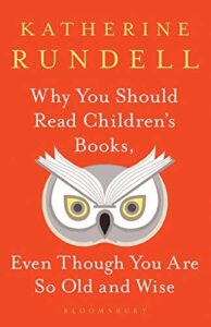 A red book cover with the title "why you should read children's books," by katherine rundell, featuring an illustration of an owl with large, captivating eyes and the subtitle "even though you are so old and wise" below.