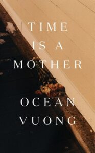 A book cover with a minimalist design featuring the title "time is a mother" by ocean vuong, against a background of what appears to be a corner where a roof meets a gutter, with some leaves gathered in the crevice, all bathed in a warm, golden hue.