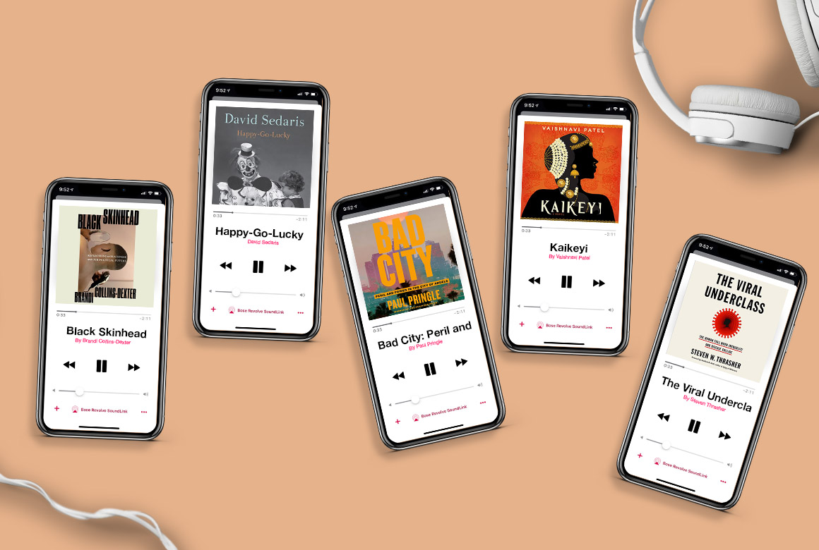A collection of smartphones displayed on a peach background showcasing a variety of audiobooks with a pair of white headphones to the side, suggesting a theme of audiobook listening.