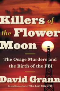 A dramatic book cover with an oil derrick against a sunset sky, for "killers of the flower moon: the osage murders and the birth of the fbi" by david grann.