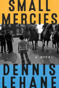 A boy stands facing a line of mounted police officers, conveying a scene of tension and confrontation. the image is overlaid with bold text that reads "small mercies" and "dennis lehane," indicating the title and author of a novel.