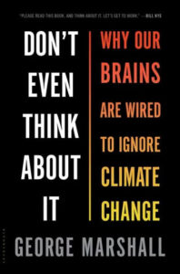 A book cover titled "don't even think about it: why our brains are wired to ignore climate change" by george marshall, featuring bold black and red text on a bright yellow background, emphasizing the psychological aspects of climate change awareness.