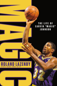 A basketball player in a purple and gold jersey, with the number 32, is captured in mid-action as he goes for a shot. the background is a striking yellow with dynamic purple text that reads "magic," referencing the player's nickname. below, the title "the life of earvin 'magic' johnson" is prominently displayed, along with the author's name, roland lazenby.