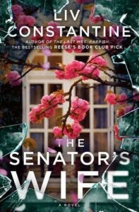 A novel of intrigue and drama, 'the senator's wife' by liv constantine, set against a backdrop of blooming pink flowers and the mysteries hidden behind the windows of power.