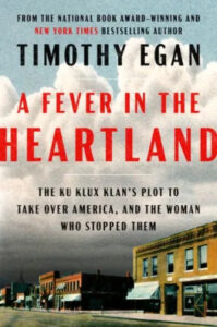 A book cover with a vintage street scene, titled "a fever in the heartland" by timothy egan, detailing the historical account of the ku klux klan's attempts to infiltrate american society and the courageous woman who stood against them.
