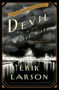 A book cover featuring the title "the devil in the white city" by erik larson, with a subtitle that reads "murder, magic, and madness at the fair that changed america". the image depicts a noir-style illustration of a cityscape at night, highlighting a grand domed building that is presumably part of the fair mentioned in the subtitle.