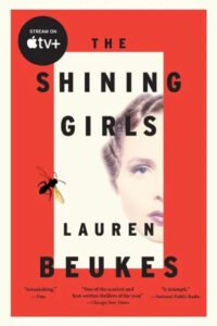 Promotional poster for "the shining girls" featuring a side-profile of a woman with literary praise and a prominent insect illustration.