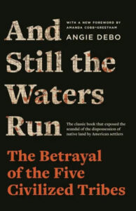 Book cover of 'and still the waters run: the betrayal of the five civilized tribes' by angie debo, detailing the scandal of dispossession experienced by native american tribes due to european settlement.