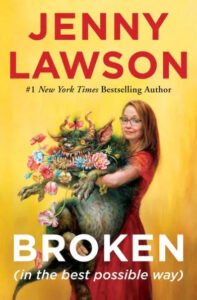 A woman in a red dress holding a whimsical creature with floral elements against a vibrant yellow background on the cover of jenny lawson's book "broken (in the best possible way).