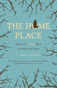 A book cover titled 'the home place: memoirs of a colored man's love affair with nature' by j. drew lanham, featuring a backdrop of bare tree branches against a teal sky with a single feather falling down the center, suggesting themes of nature, contemplation, and personal narrative.