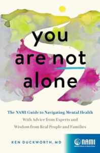 A book cover with an abstract watercolor design in green, yellow, pink, and purple, featuring the title "you are not alone" in bold, white letters, with a subtitle "the nami guide to navigating mental health with advice from experts and wisdom from real people and families" by ken duckworth, m.d.