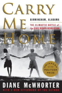 A book cover with a title "carry me home," featuring silhouettes of three individuals walking hand in hand with a background that evokes a historical, possibly civil rights movement-related scene.