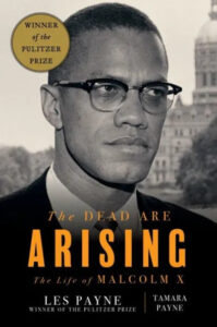 A book cover featuring an iconic black-and-white portrait of malcolm x, with the title "the dead are arising: the life of malcolm x" by les payne and tamara payne, noted as a winner of the pulitzer prize.